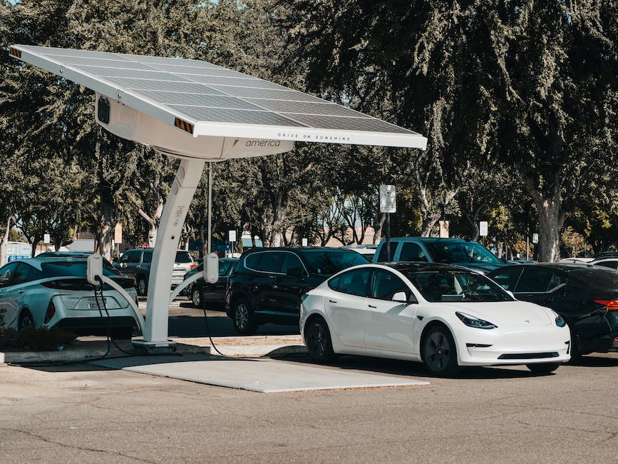 An image of an electric vehicle being charged at a charging station